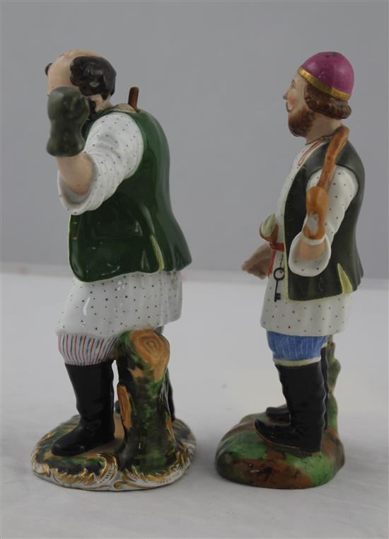 Two porcelain figures of a water carrier and a peasant